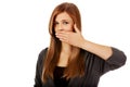Teen woman covering her mouth with hand Royalty Free Stock Photo