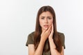 Teen woman pressing her bruised cheek with a painful expression as if she is having a terrible tooth ache Royalty Free Stock Photo