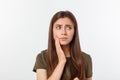 Teen woman pressing her bruised cheek with a painful expression as if she is having a terrible tooth ache Royalty Free Stock Photo