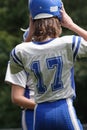 Teen Youth Football Player Putting on Helmut Royalty Free Stock Photo