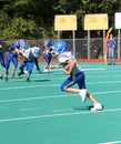 Teen Youth Football Player Running with the Ball Royalty Free Stock Photo