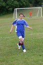 Teen Youth Soccer In Action on Field Royalty Free Stock Photo