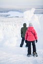 Teenaders hiking in snowshoes Royalty Free Stock Photo