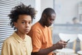 Teenage African-American Boy Waiting in Line