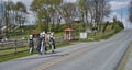 Teenage Amish Boys and Girls Walking Along a Rural Road