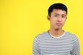 Teenage Asian boy with serious expression, head and shoulders Royalty Free Stock Photo