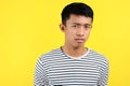 Teenage Asian boy with serious expression, head and shoulders Royalty Free Stock Photo