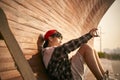 teenage asian skateboarder child taking a selfie