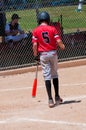 Teenage baseball player from behind.