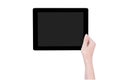 Teenage beautiful girl holding a black tablet pc template with gray screen isolated on white background, close up, mock up, Royalty Free Stock Photo