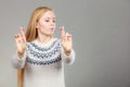 Teenage blonde woman making promise gesture Royalty Free Stock Photo