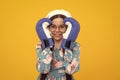 Teenage boxer girl in boxing gloves on yellow isolated background.