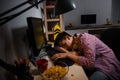 Teenage boy addicted to computer games. falling asleep in front of computer. Royalty Free Stock Photo