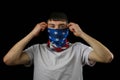Teenage boy American Flag mask black background Royalty Free Stock Photo