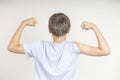 Teenage boy with bandage plaster on his arm makes fist and flexes her bicep after vaccination. Injection covid vaccine Royalty Free Stock Photo