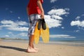 Teenage boy on beach with flippers Royalty Free Stock Photo