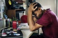 Teenage boy in a bedroom doing work stressed out and frustrated Royalty Free Stock Photo