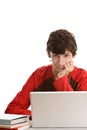 Teenage boy behind desk with laptop Royalty Free Stock Photo