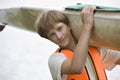 Teenage Boy Carrying Kayak Royalty Free Stock Photo