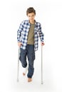 Teenage Boy with crutches and a bandage on his right leg