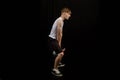 Teenage boy doing kettlebell swings Royalty Free Stock Photo