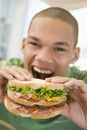 Teenage Boy Eating Sandwich Royalty Free Stock Photo