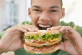 Teenage Boy Eating Sandwich Royalty Free Stock Photo