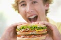 Teenage Boy Eating Sandwich Royalty Free Stock Photo