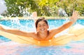 Teenage boy enjoying summertime in swimming pool Royalty Free Stock Photo