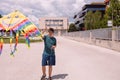 Teenage Boy flying kite on a sunny day Royalty Free Stock Photo