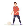 Teenage boy football player, in a red sports shirt, kicks a soccer ball. Kid sportsman playing football game, dynamic Royalty Free Stock Photo