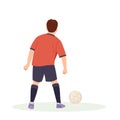 Teenage boy football player, in a red sports shirt, kicks a soccer ball. Kid sportsman playing football game, dynamic Royalty Free Stock Photo