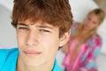 Teenage boy and girl in bedroom Royalty Free Stock Photo