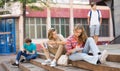 Teenage boy and girl sitting on steps near school Royalty Free Stock Photo