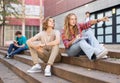 Teenage boy and girl sitting on steps near school Royalty Free Stock Photo
