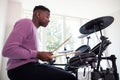 Teenage Boy Having Fun Playing Electronic Drum Kit At Home Royalty Free Stock Photo