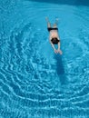 Teenage boy having joy in blue water of swimming pool Royalty Free Stock Photo