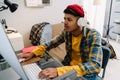 Teenage boy playing video game on desktop computer at home Royalty Free Stock Photo