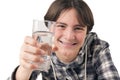Teenage boy holding glass of water