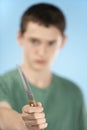 Teenage Boy Holding Knife