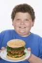 Teenage Boy Holding Plate Of Hamburger Royalty Free Stock Photo