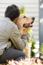 Teenage boy hugging pet dog Royalty Free Stock Photo
