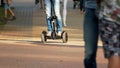 Teenage boy in jeans riding hyroscooter outdoors. Royalty Free Stock Photo