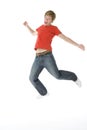 Teenage Boy Jumping In The Air Royalty Free Stock Photo