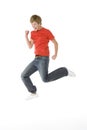 Teenage Boy Jumping In The Air Royalty Free Stock Photo