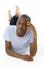 Teenage Boy Laying On Stomach Royalty Free Stock Photo