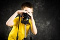 Teenage boy using big digital camera Royalty Free Stock Photo