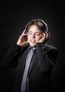 Teenage boy listening music in headphones Royalty Free Stock Photo