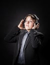 Teenage boy listening music in headphones Royalty Free Stock Photo