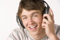 Teenage Boy Listening To Music On Headphones Royalty Free Stock Photo